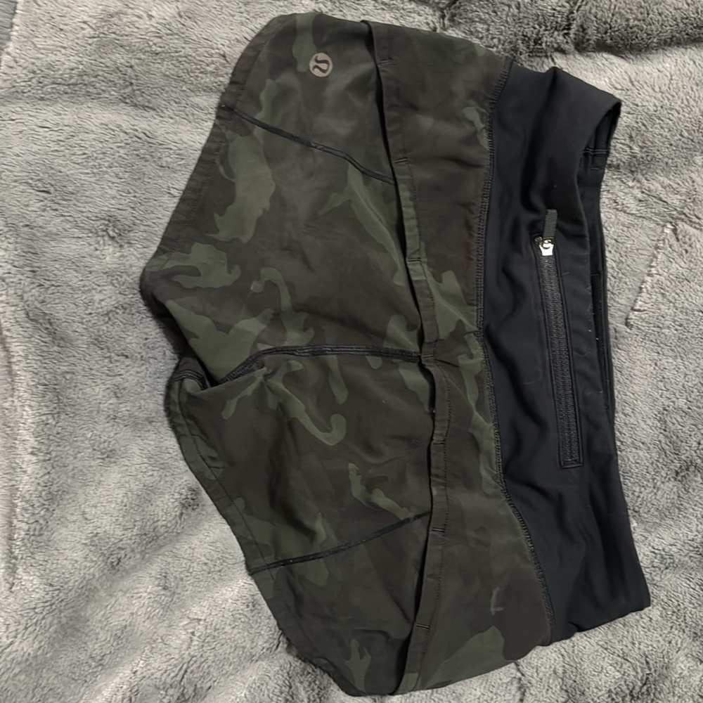 Slight discoloration to right front. Super cute green/black camouflage.